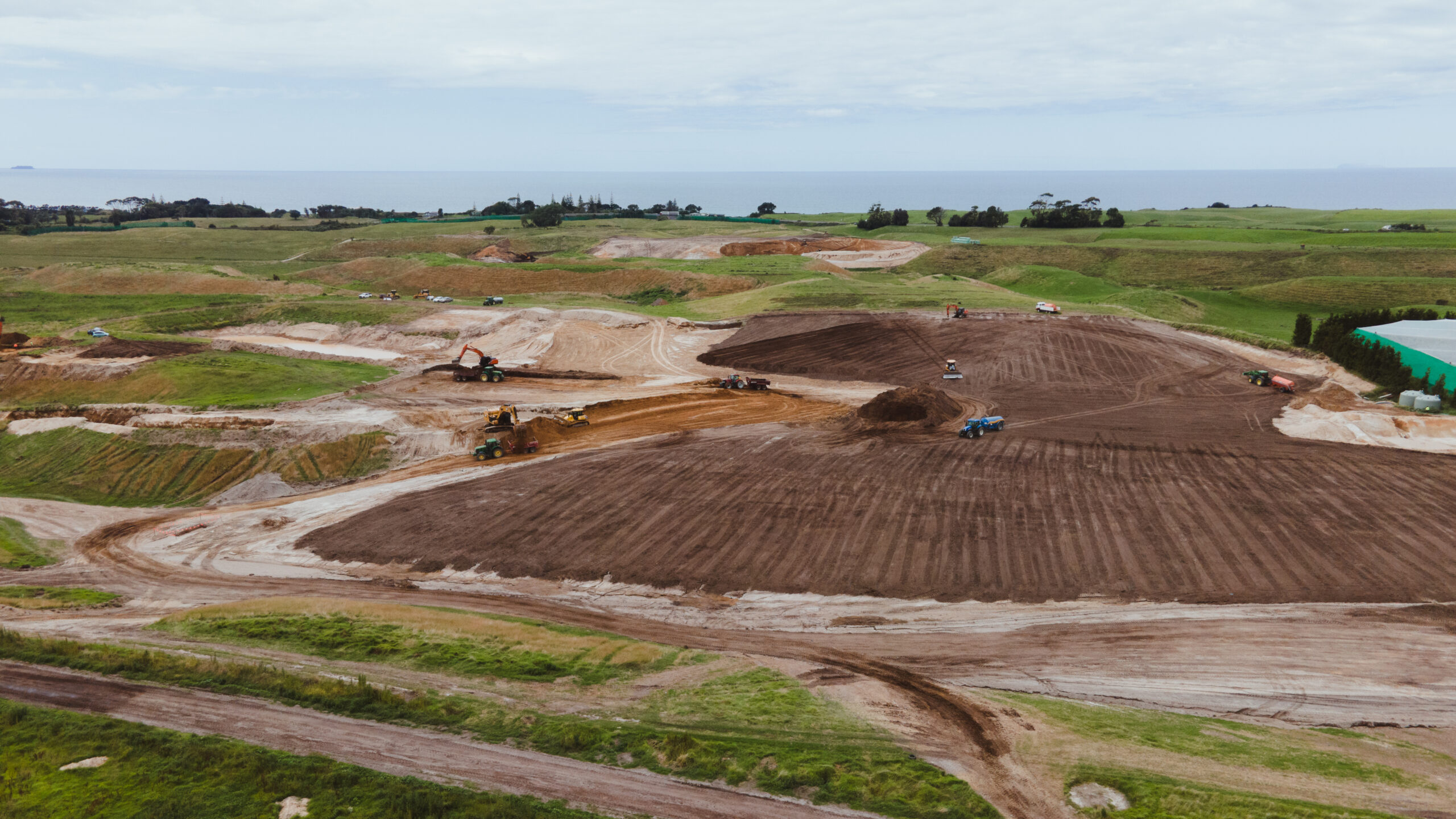 Newly developed Baygold kiwifruit orchard with support structures across rolling Bay of Plenty land